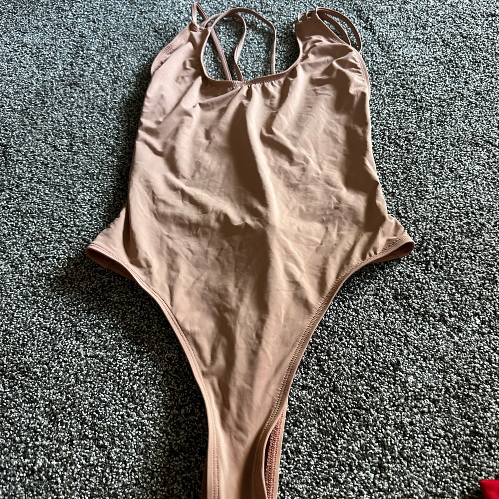 Tan swimsuit thong